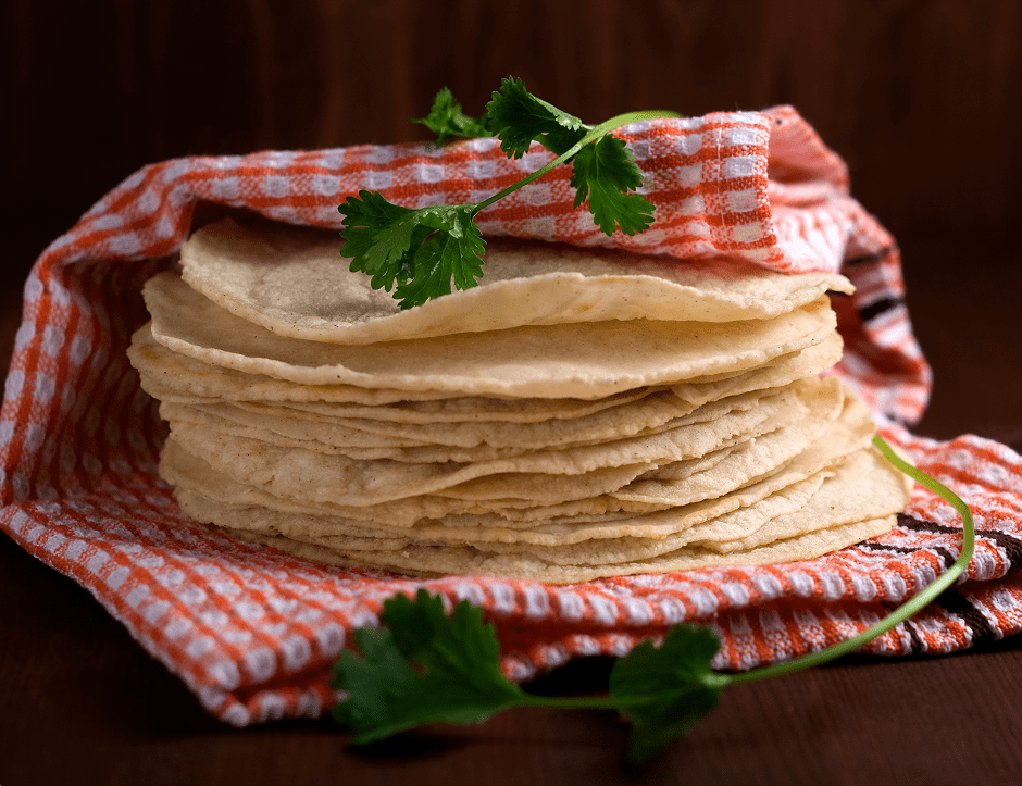 Fresh tortillas on checkered cloth