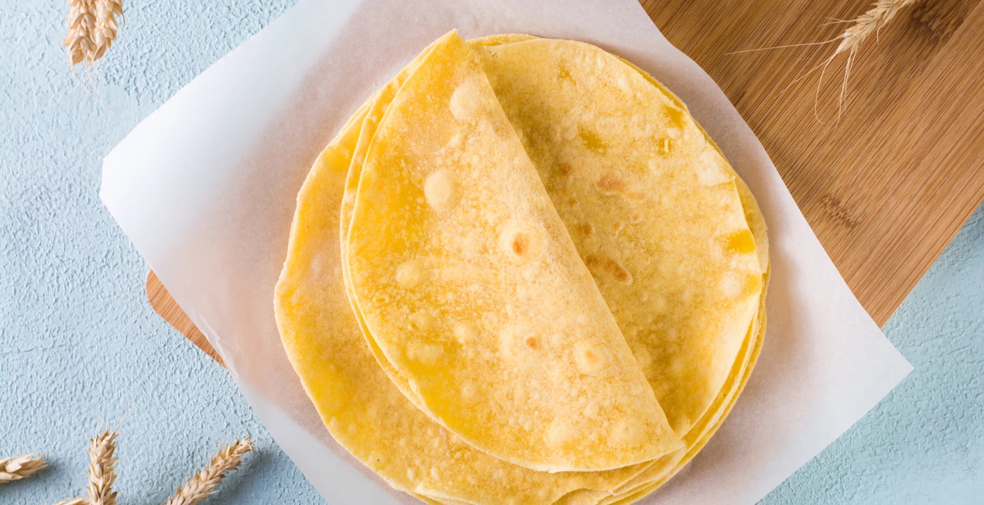 Corn tortillas on parchment paper