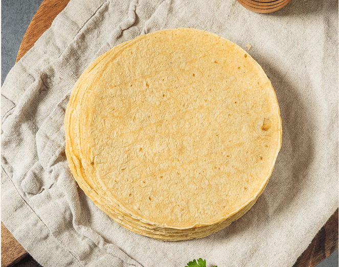 Stack of corn tortillas on cloth